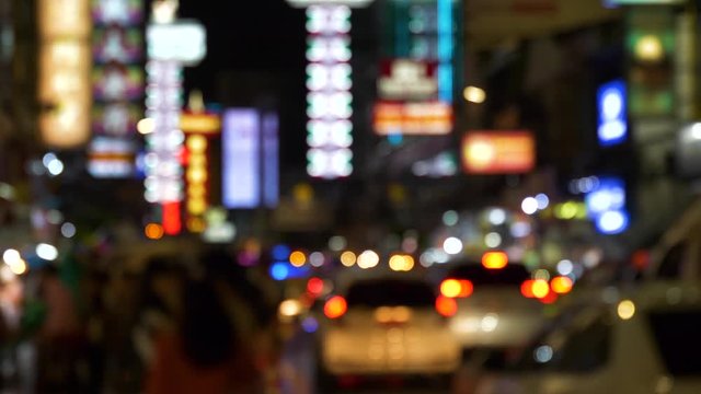 Blur night city background of famous traveller landmark chinatown at Yaowarat , Bangkok , Thailand.
