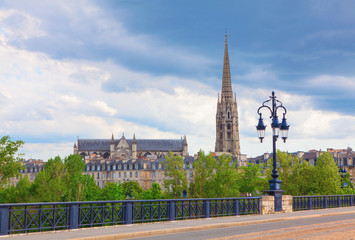 Fototapeta na wymiar view of Bordeaux bridge with St Michel cathedral , France