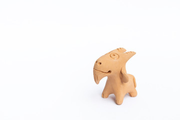 Handmade clay goat toy or decorate item isolate on white background