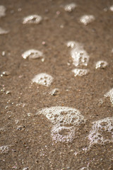 Close-Up of Water Bubbles on Wet Sand