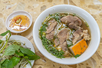 Bowl of delicious Vietnamese beef bone noodles soup 