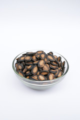 Watermelon seeds are in the glass bowl.isolated on white background.
