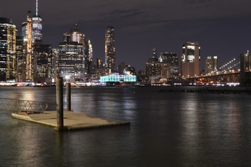 Fototapeta na wymiar New York skyline at night, pier and harbor 