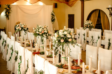 Beautiful flowers on table in wedding day. Rustic style wedding table decoration and setting