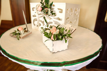Beautiful flowers on table in wedding day. Rustic style wedding table decoration and setting