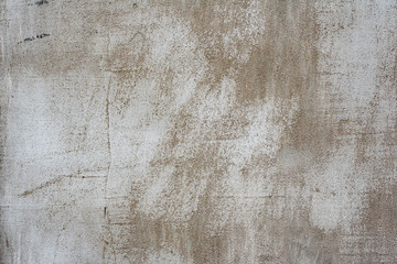 Texture of a concrete wall with cracks and scratches which can be used as a background