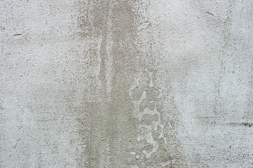 Texture of a concrete wall with cracks and scratches which can be used as a background