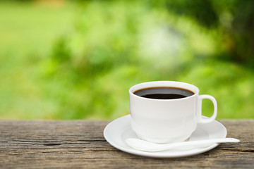 cup of coffee on wooden table