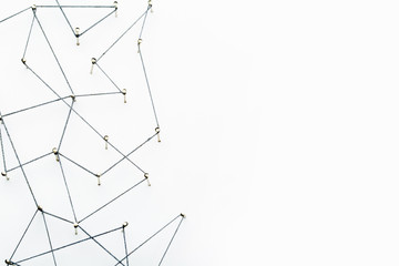 A large grid of pins connected with string. Communication, technology, network concept