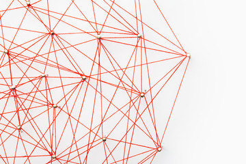 A large grid of pins connected with string. Communication, network concept