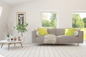 Stylish room in white color with sofa and summer landscape in window. Scandinavian interior design. 3D illustration