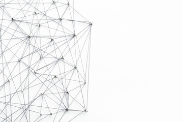 A large grid of pins connected with string. Communication, technology, network concept
