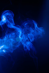 Blue smoke motion on black background.
