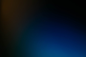Blur colored lights. Dark blue and yellow abstract art background. Defocused lens flare.