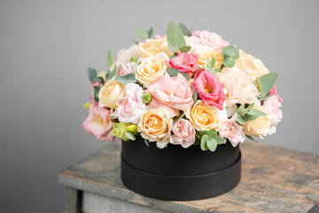 Beautiful bouquet of mixed flowers in round box. the work of the florist at a flower shop. Fresh cut flower.