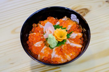 Sashimi bowl set.Sliced salmon and tuna,sea urchin(uni) and salmon roe in a bowl.Jepanese food.