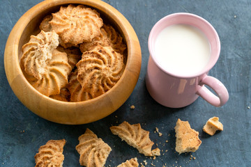 milk in a cup with cookies