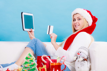 Girl with tablet credit card doing online shopping