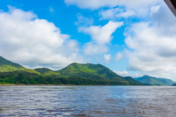 Beautiful green hills landscape and rivers on blue sky background. decoration image contain certain grain noise and soft focus.