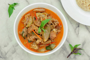 Beef in red curry with coconut milk and holy basil