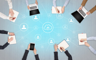 Group of people with devices in hands working in team on tablets, laptops with office, connection,...
