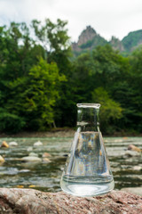 Glass flask with clean drinking water.