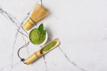 Green matcha tea?powder with bamboo chasen and scoop