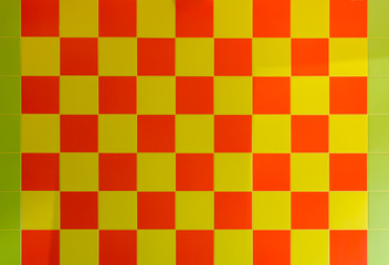 background of yellow and orange square ceramic tiles