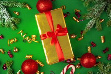 Top view of wrapped present on a green festive background