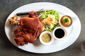 Crispy German pork leg with a delicious salad