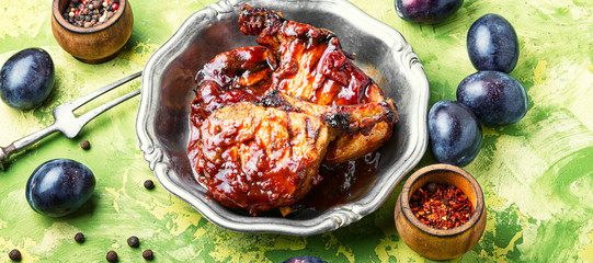 Grilled meat in plum sauce