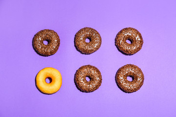 Tasty donuts on color background. Concept of uniqueness