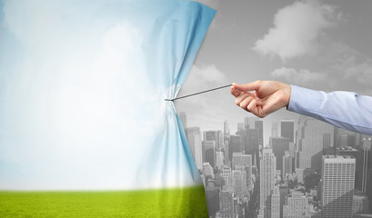 hand pulling nature cityscape curtain to gray cityscape, environmental protection concept