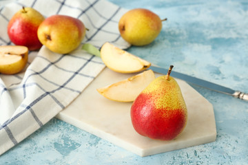 Tasty fresh pears on color background