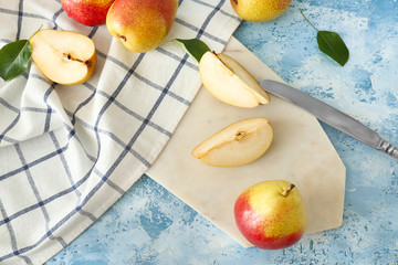 Tasty fresh pears on color background