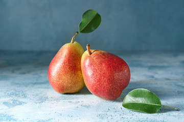 Tasty fresh pears on color background