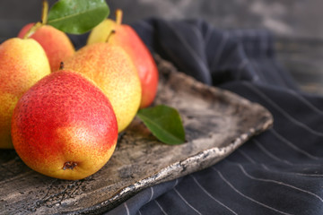 Plate with tasty fresh pears on table, closeup