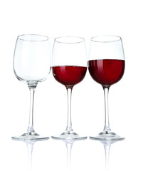 Glasses of wine on white background