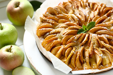 Sweet apple pie on table