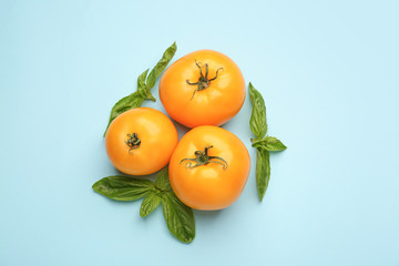 Fresh tomatoes on color background