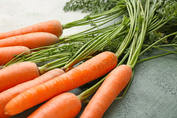 Bunch of fresh carrot on table