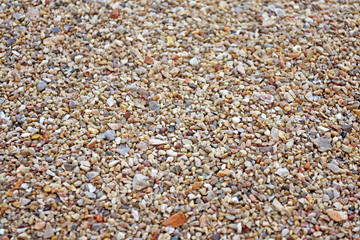 Sea pebble. Colorful small pebble and stone texture. Detailed sand texture.