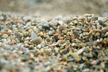 Sea pebble. Colorful small pebble and stone texture. Detailed sand texture.
