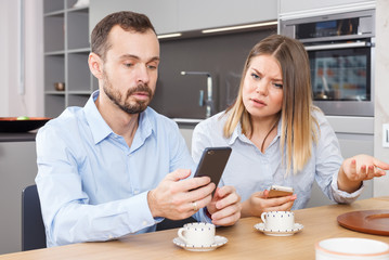 Irritated spouses with phones