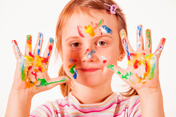 Little cute child girl showing painted hands. Horizontal photo.