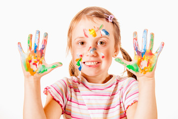 Humorous portrait of little cute girl with children's makeup and painting colorful hands....