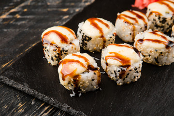 Delicious rolls with fish and cheese	