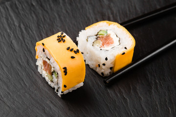 Delicious rolls with fish and cheese	