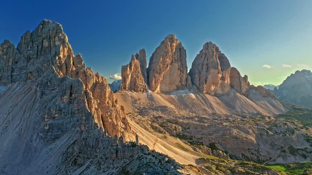 Majestic aerial view of Tre Cime and mountain shelter, Dolomites