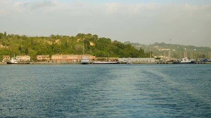 Ship, boat, ferryboat without people moored on the Ionian coastline in Greece. 4K